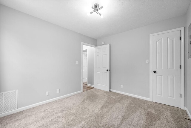 3441 Foxrun Ln, Clarksville, TN 37042 - unfurnished bedroom with visible vents, carpet flooring, a textured ceiling, and baseboards