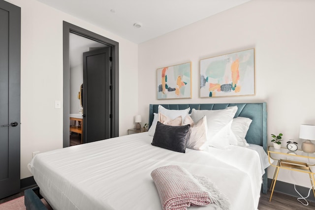 bedroom with wood finished floors