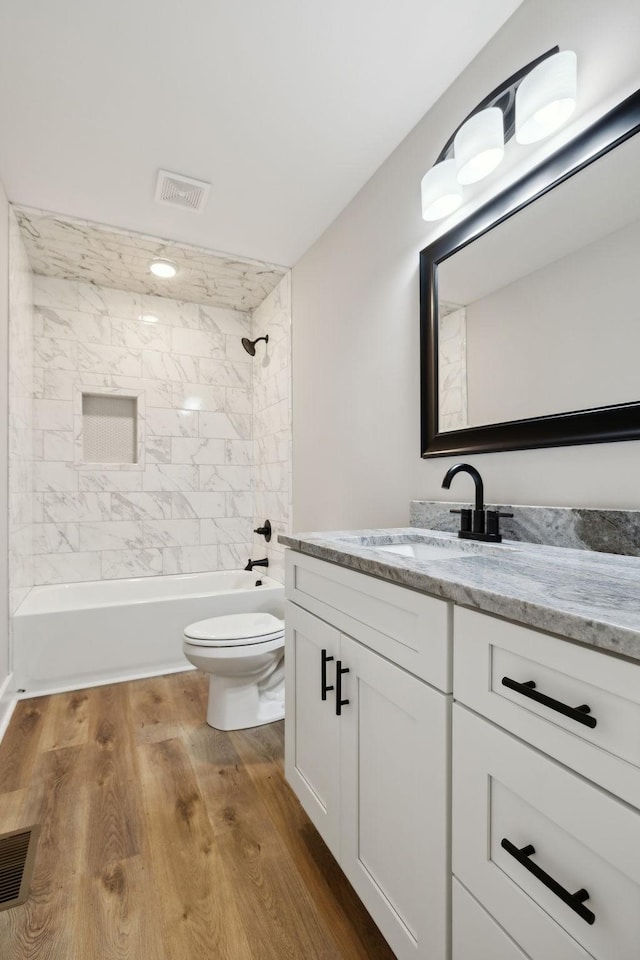 1507 New Harmony Rd, Hartsville, TN 37074 - full bathroom with vanity, toilet, bathtub / shower combination, and wood finished floors