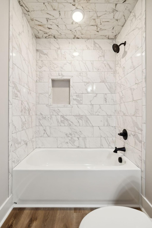 1507 New Harmony Rd, Hartsville, TN 37074 - bathroom with shower / washtub combination, toilet, wood finished floors, and baseboards