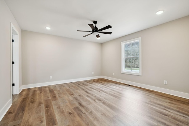 1507 New Harmony Rd, Hartsville, TN 37074 - spare room featuring wood finished floors, a ceiling fan, baseboards, and recessed lighting