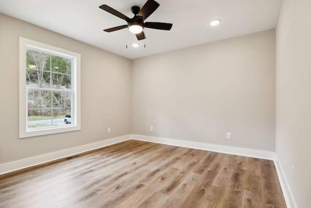 1507 New Harmony Rd, Hartsville, TN 37074 - spare room featuring wood finished floors, baseboards, a ceiling fan, and recessed lighting