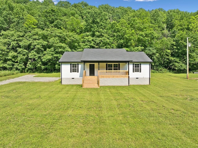 1507 New Harmony Rd, Hartsville, TN 37074 - view of front facade with crawl space, covered porch, a front lawn, and a view of trees