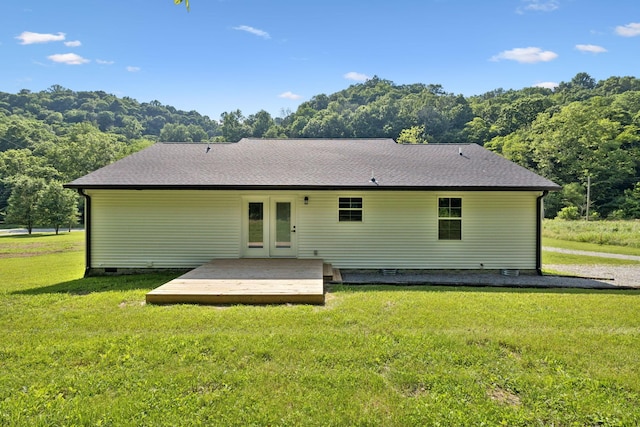1507 New Harmony Rd, Hartsville, TN 37074 - back of house with a wooden deck, a lawn, and roof with shingles