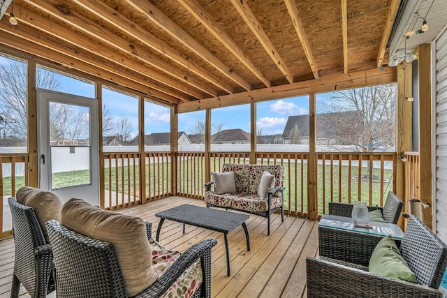 sunroom / solarium featuring a healthy amount of sunlight