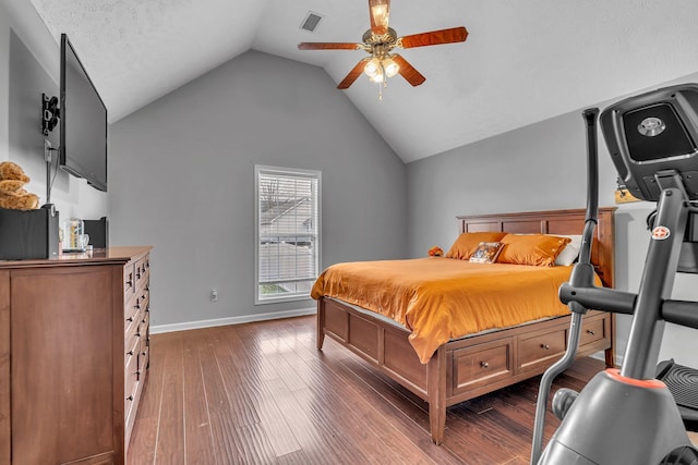 bedroom featuring vaulted ceiling, baseboards, visible vents, and dark wood-style flooring