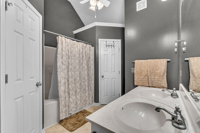 bathroom featuring tile patterned flooring, vaulted ceiling, visible vents, and a sink