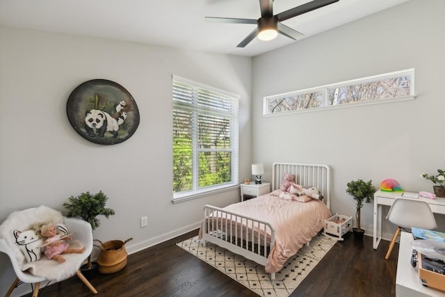 bedroom featuring a ceiling fan, baseboards, and wood finished floors