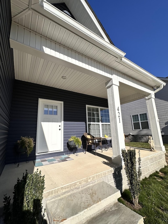 doorway to property featuring covered porch