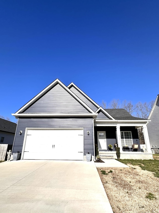 ranch-style house with an attached garage, a porch, and driveway