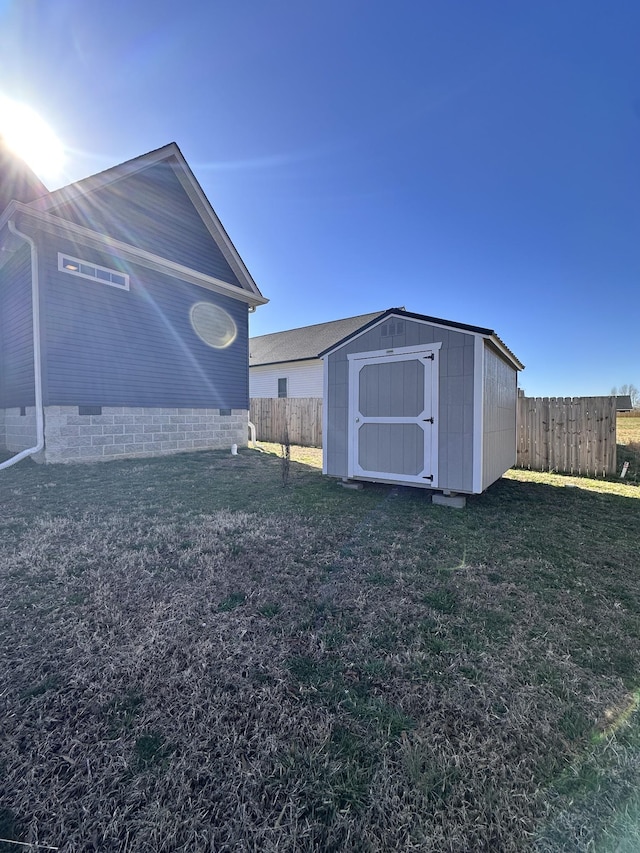 view of shed with fence