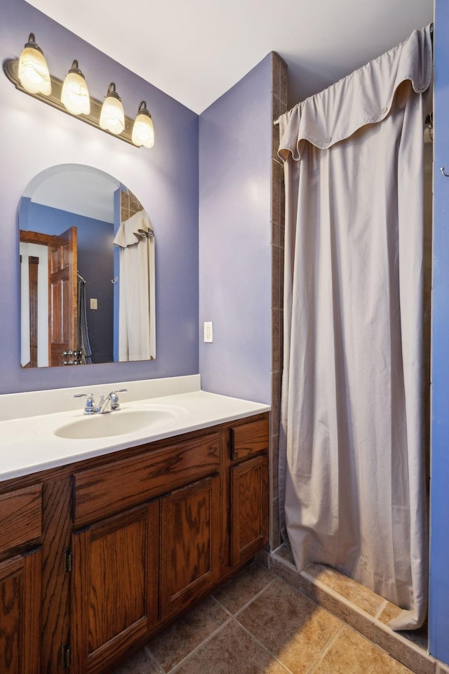 bathroom featuring tile patterned floors, a shower with curtain, and vanity