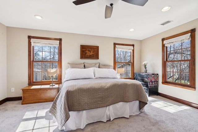 bedroom featuring visible vents, light carpet, recessed lighting, baseboards, and ceiling fan