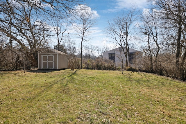 view of yard with an outbuilding and a storage shed