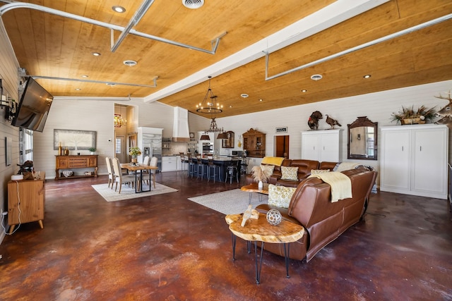 living room with lofted ceiling with beams, wooden ceiling, recessed lighting, and finished concrete flooring