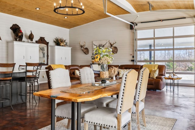 dining space featuring a chandelier, wooden ceiling, and finished concrete flooring