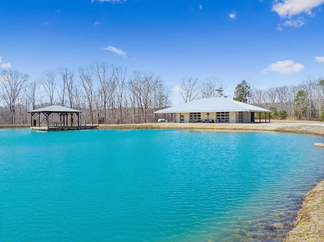 view of swimming pool featuring a gazebo and a water view