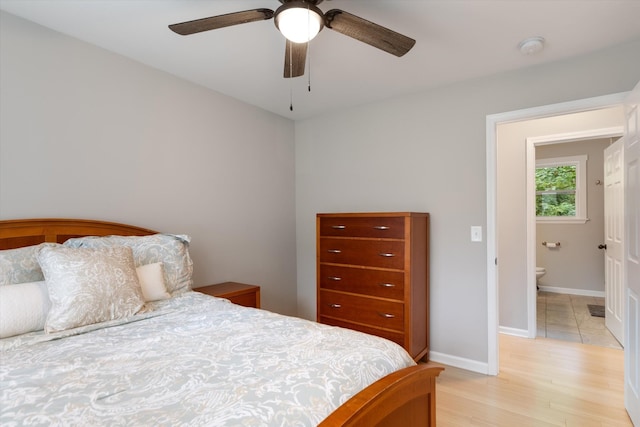 bedroom with baseboards, a ceiling fan, and light wood finished floors