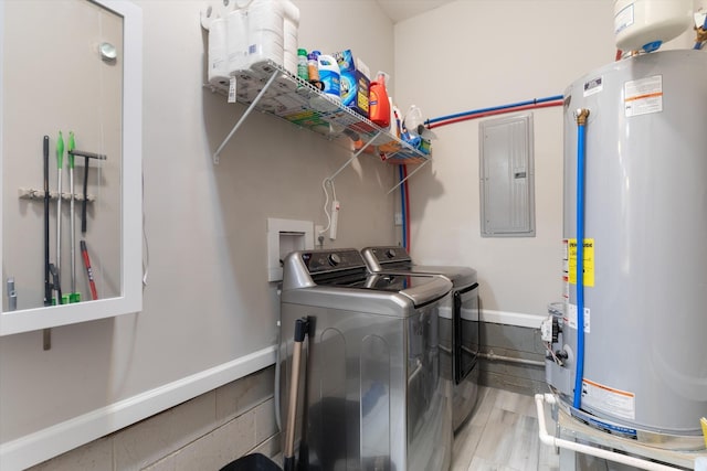 laundry area featuring laundry area, electric panel, water heater, and washing machine and clothes dryer