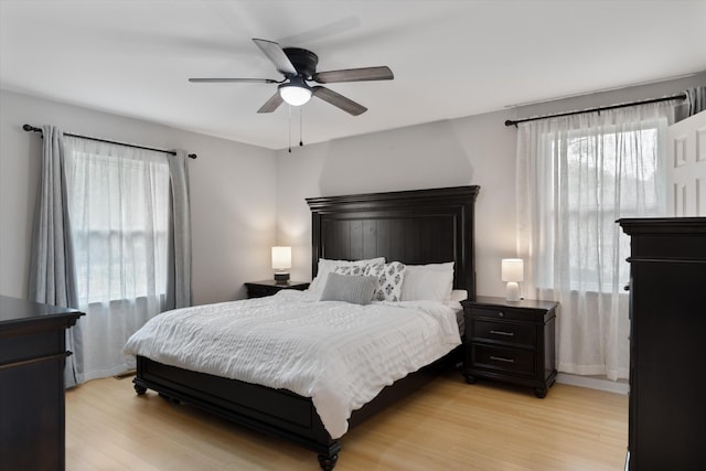 bedroom featuring light wood-style flooring and ceiling fan