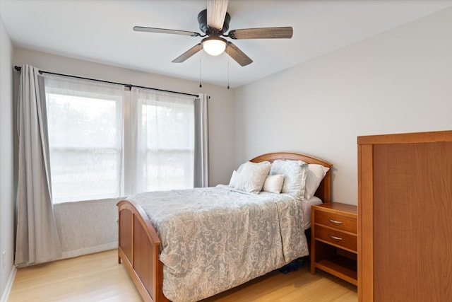 bedroom featuring ceiling fan and light wood-style floors