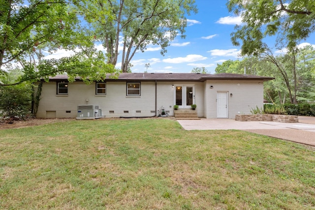 back of house with a patio, a yard, central AC, crawl space, and brick siding