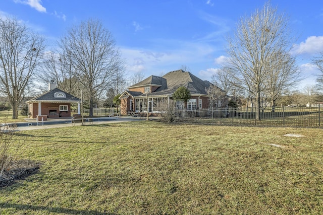 exterior space with a pool, a storage structure, fence, an outbuilding, and a patio