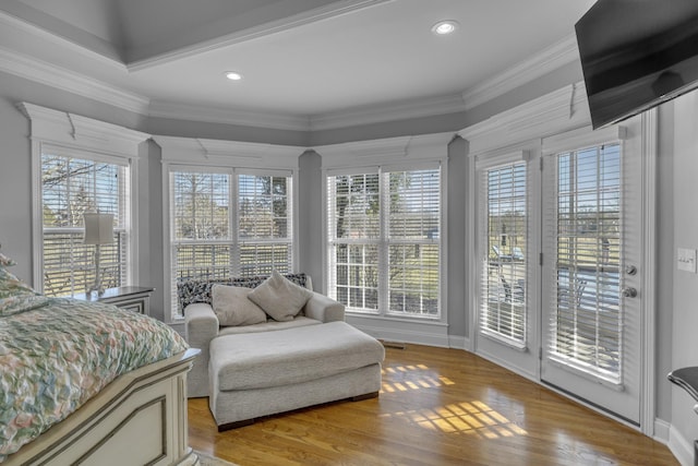 bedroom featuring baseboards, recessed lighting, ornamental molding, access to exterior, and light wood-style floors