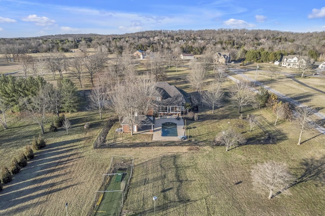 birds eye view of property with a rural view