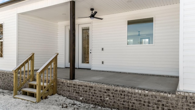 property entrance with ceiling fan