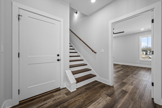 staircase with recessed lighting, baseboards, and wood finished floors