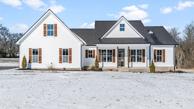 view of front of home with roof with shingles