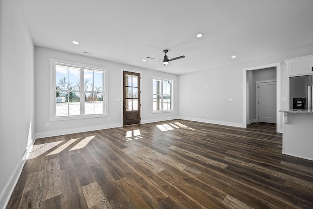 unfurnished living room with dark wood-type flooring, recessed lighting, and visible vents