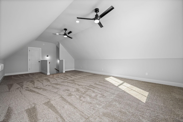 bonus room with carpet flooring, baseboards, and vaulted ceiling