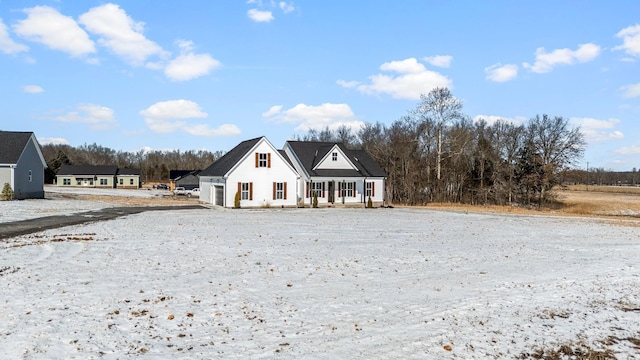 view of front of property with a porch and a garage