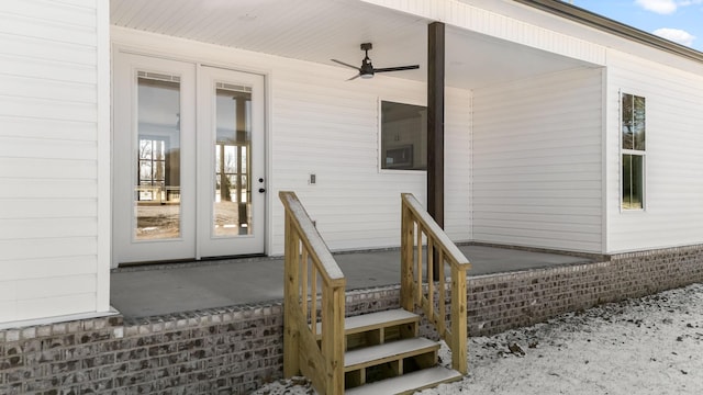 view of exterior entry with french doors and ceiling fan