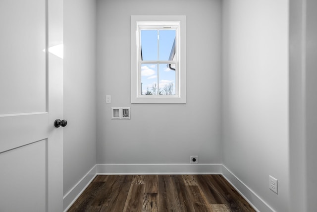 laundry room with baseboards, hookup for an electric dryer, hookup for a washing machine, and laundry area