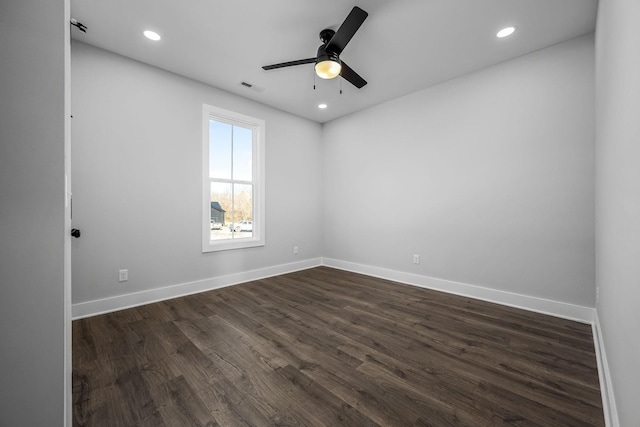 unfurnished room with recessed lighting, baseboards, and dark wood-style flooring