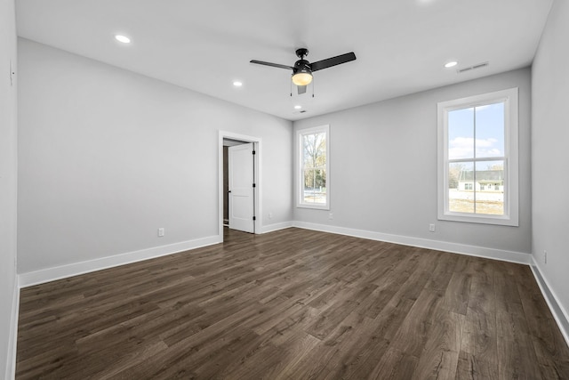 empty room featuring visible vents, baseboards, dark wood finished floors, recessed lighting, and a ceiling fan