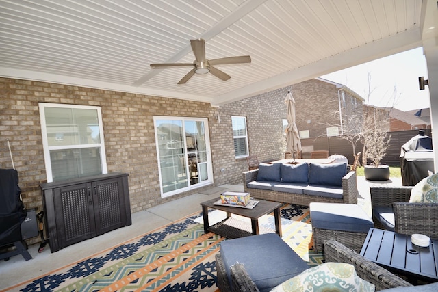 view of patio / terrace with outdoor lounge area, ceiling fan, and fence