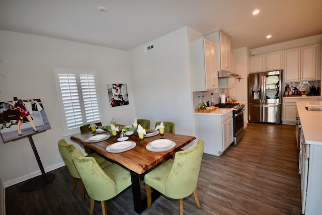 dining room with visible vents, recessed lighting, baseboards, and dark wood-style flooring