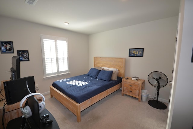 bedroom with visible vents, carpet floors, and baseboards