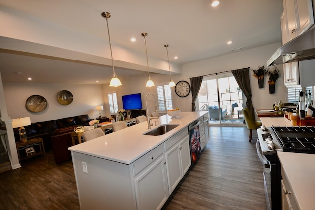 kitchen featuring a sink, black dishwasher, open floor plan, dark wood finished floors, and range with gas cooktop