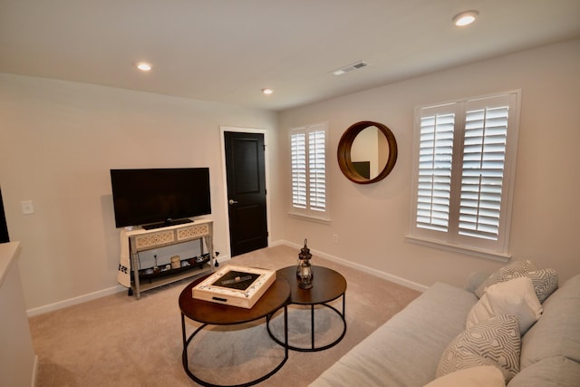 living room featuring recessed lighting, baseboards, visible vents, and light carpet