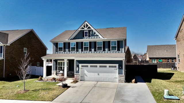 view of front of house featuring a porch, a front lawn, and fence