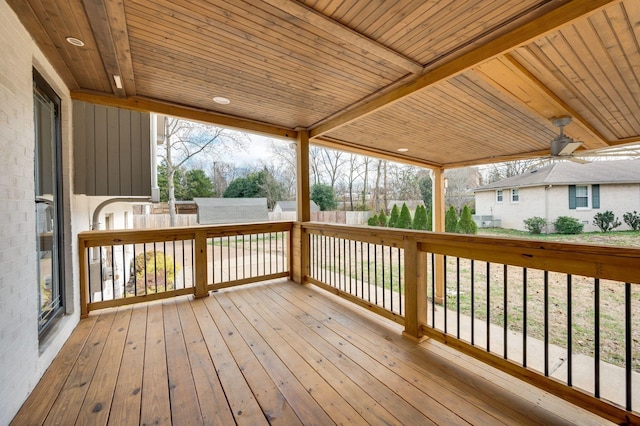 deck with an outdoor structure and fence