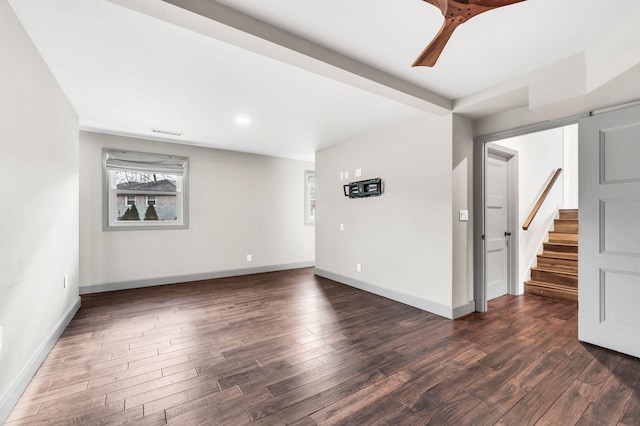 interior space featuring stairway, ceiling fan, baseboards, and wood finished floors