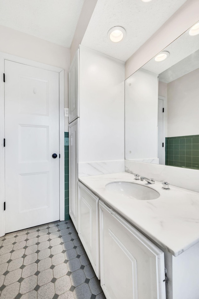 bathroom with vanity and tile patterned floors