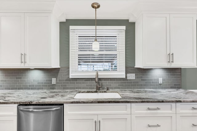 kitchen featuring stainless steel dishwasher, white cabinets, and a sink