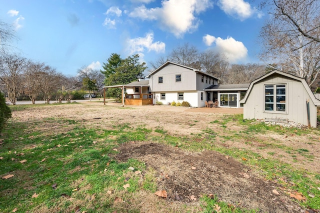 back of house with a gambrel roof